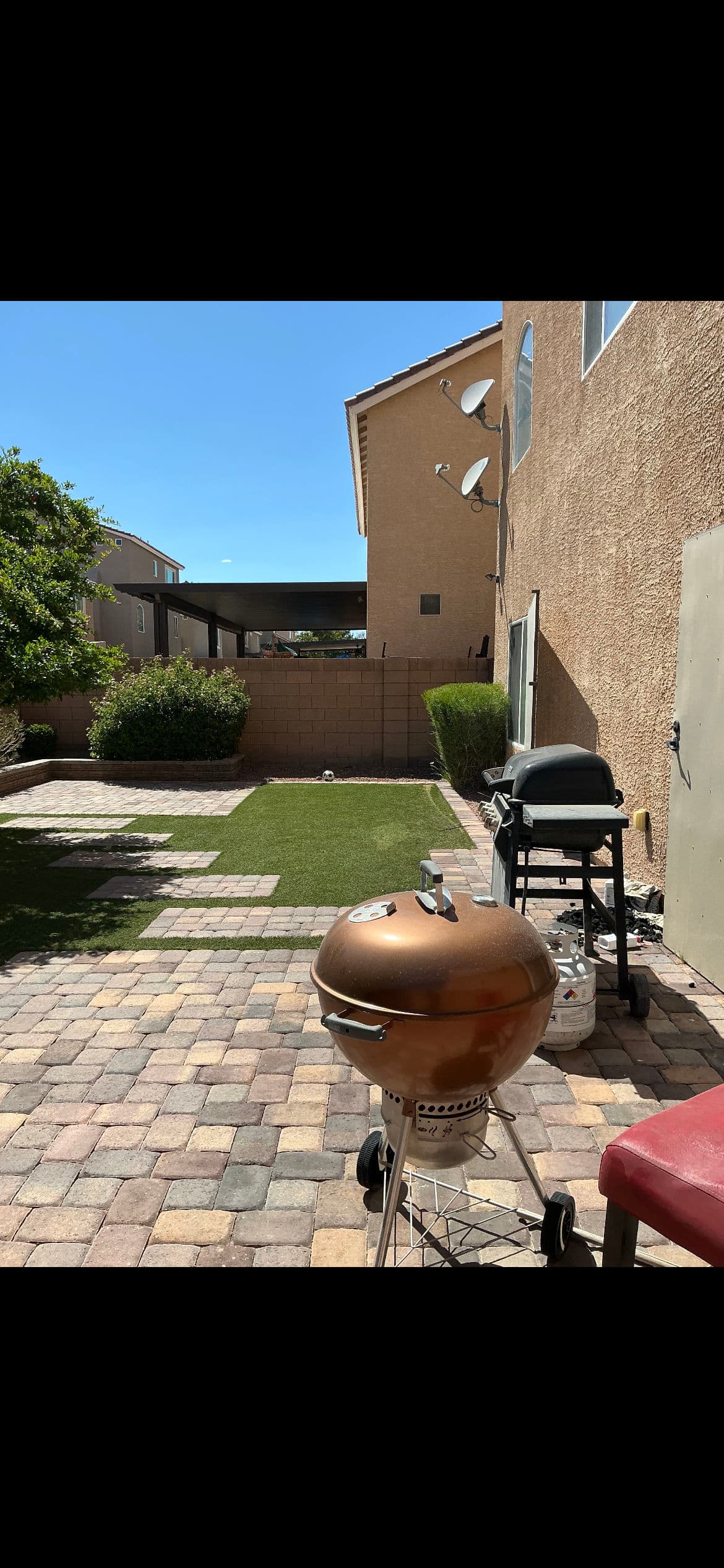 Backyard Patio Design with Turf and Pavers Done Right image